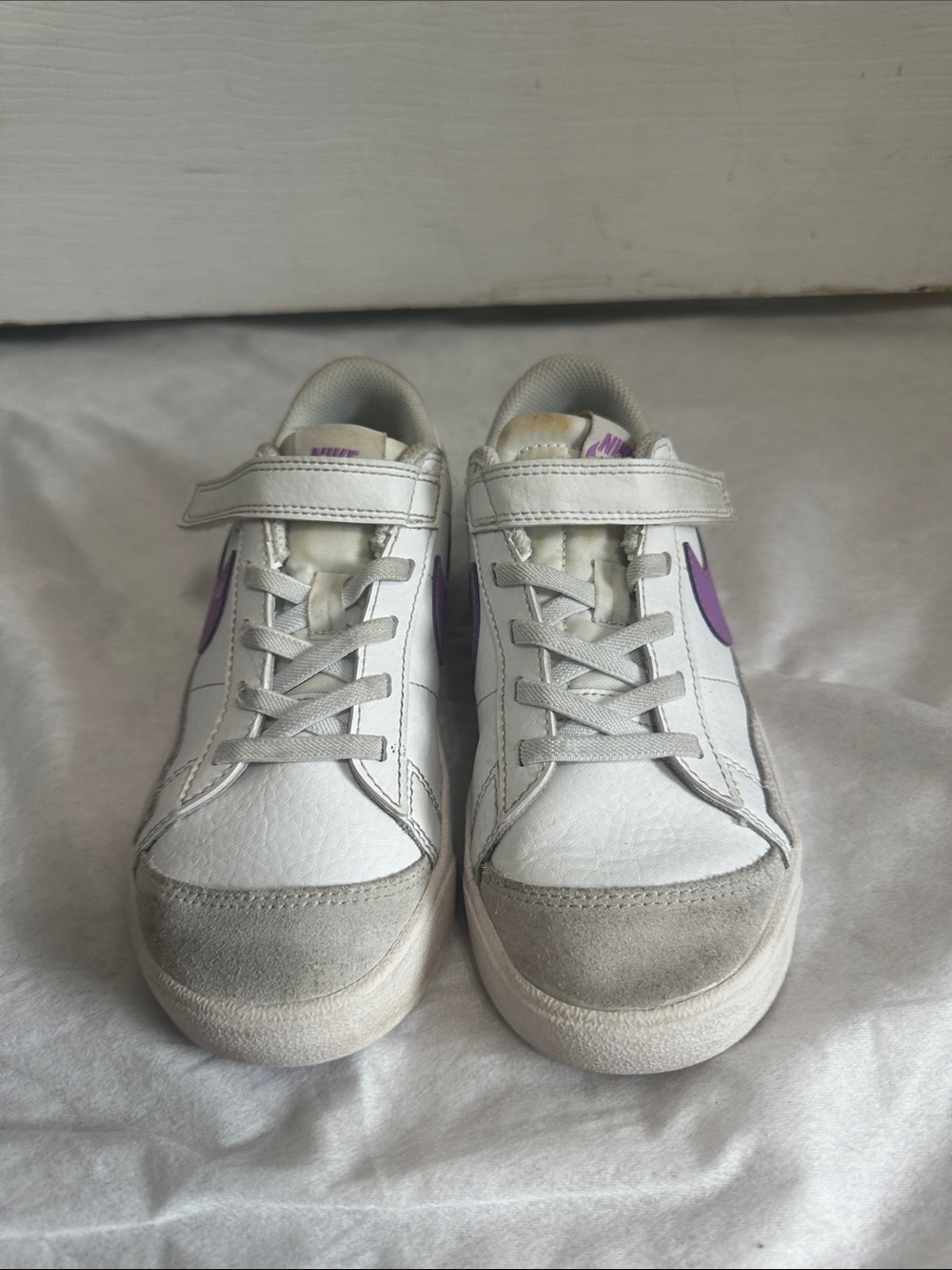 Nike Kids White Sneakers with Purple Swoosh